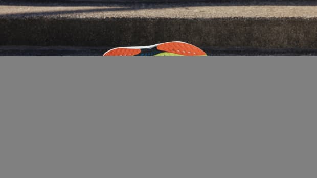 View of blue and orange Reebok shoes.